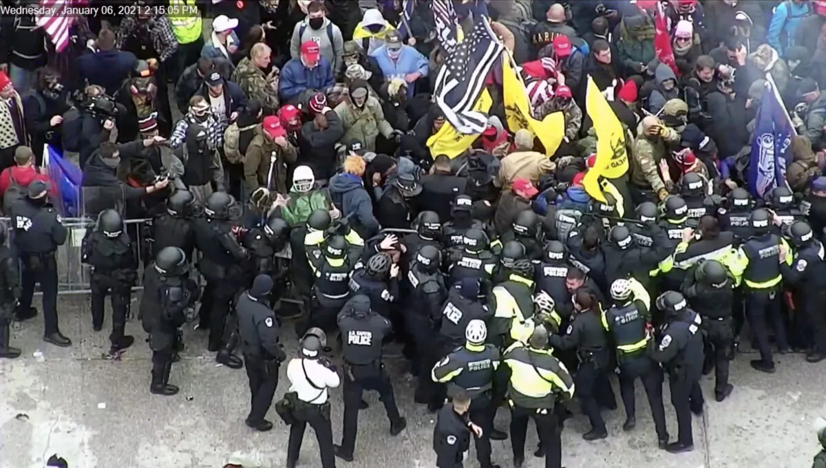 Protesters clash with police on the west front of the U.S. Capitol on Jan. 6, 2021, as shown on a CCTV exterior Rotunda camera. (U.S. Capitol Police/Screenshot via The Epoch Times)