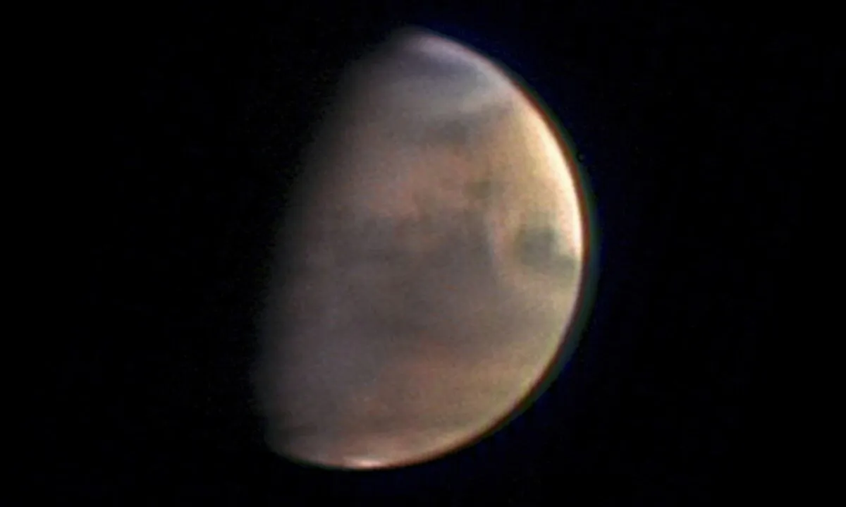 Mars as the Mars Express spacecraft approaches the planet from a distance of 5.5 million kilometers. (European Space Agency via AP)