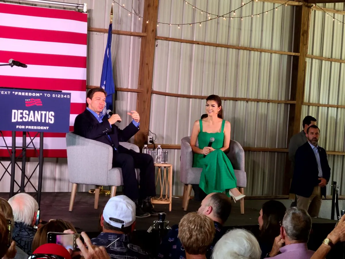Florida Gov. Ron DeSantis, a Republican candidate for president, speaks on stage with his wife, Casey DeSantis, at a campaign stop in Gilbert, S.C., on June 2, 2023. (Dan M. Berger/The Epoch Times)
