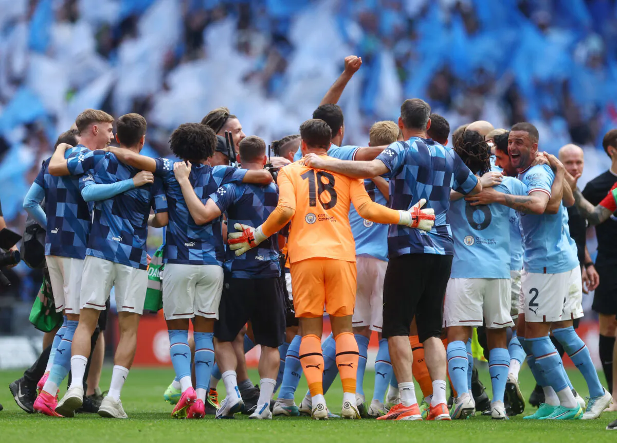 Manchester City's Kyle Walker and teammates celebrate after winning the FA Cup final between Manchester City and Manchester United at Wembley Stadium in London on June 3, 2023. (Paul Childs/Action Images via Reuters)