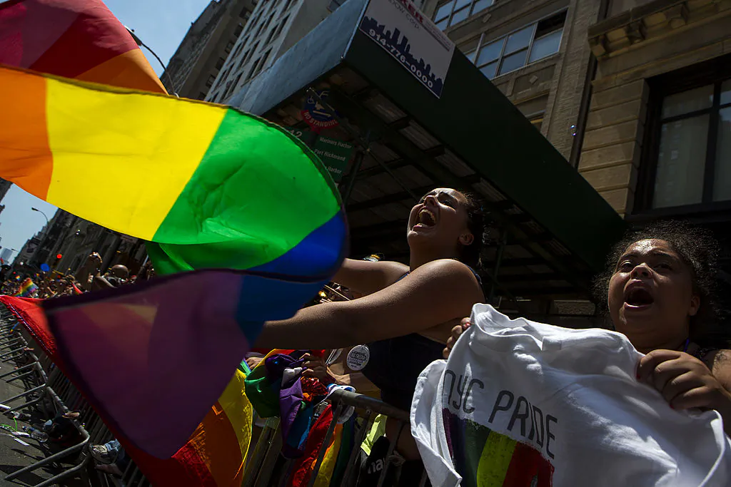 Marchers walk down 5th Avenue during the 2014 Gay Pride March on June 29, 2014 in New York City. (Photo by Eric Thayer/Getty Images)