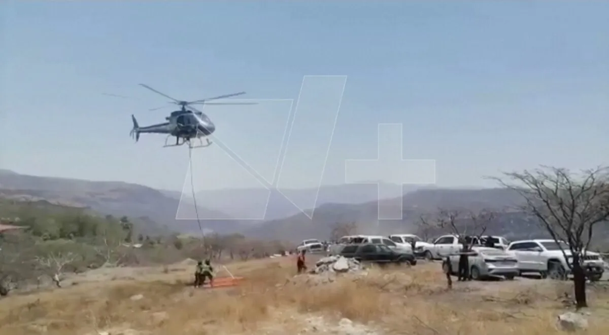Researchers work at the scene where dozens of bags containing human remains were found, in Jalisco state, Mexico, on June 1, 2023, in a still from video. (Telemundo via Reuters/Screenshot via The Epoch Times)
