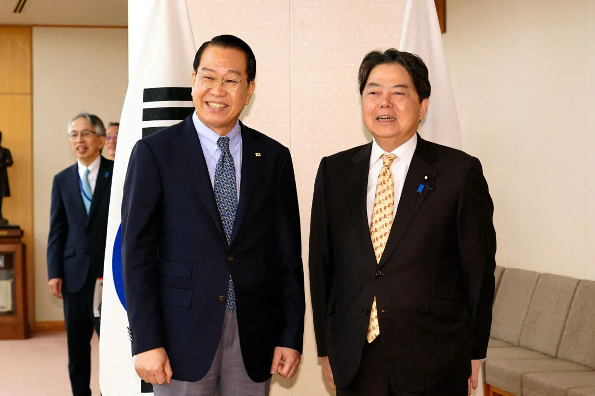 Japan's Foreign Minister Yoshimasa Hayashi (R) poses with South Korea's Unification Minister Kwon Young-se (front L) during the latter's visit in Tokyo on March 23, 2023. (Japan Pool / JIJI Press / AFP via Getty Images)