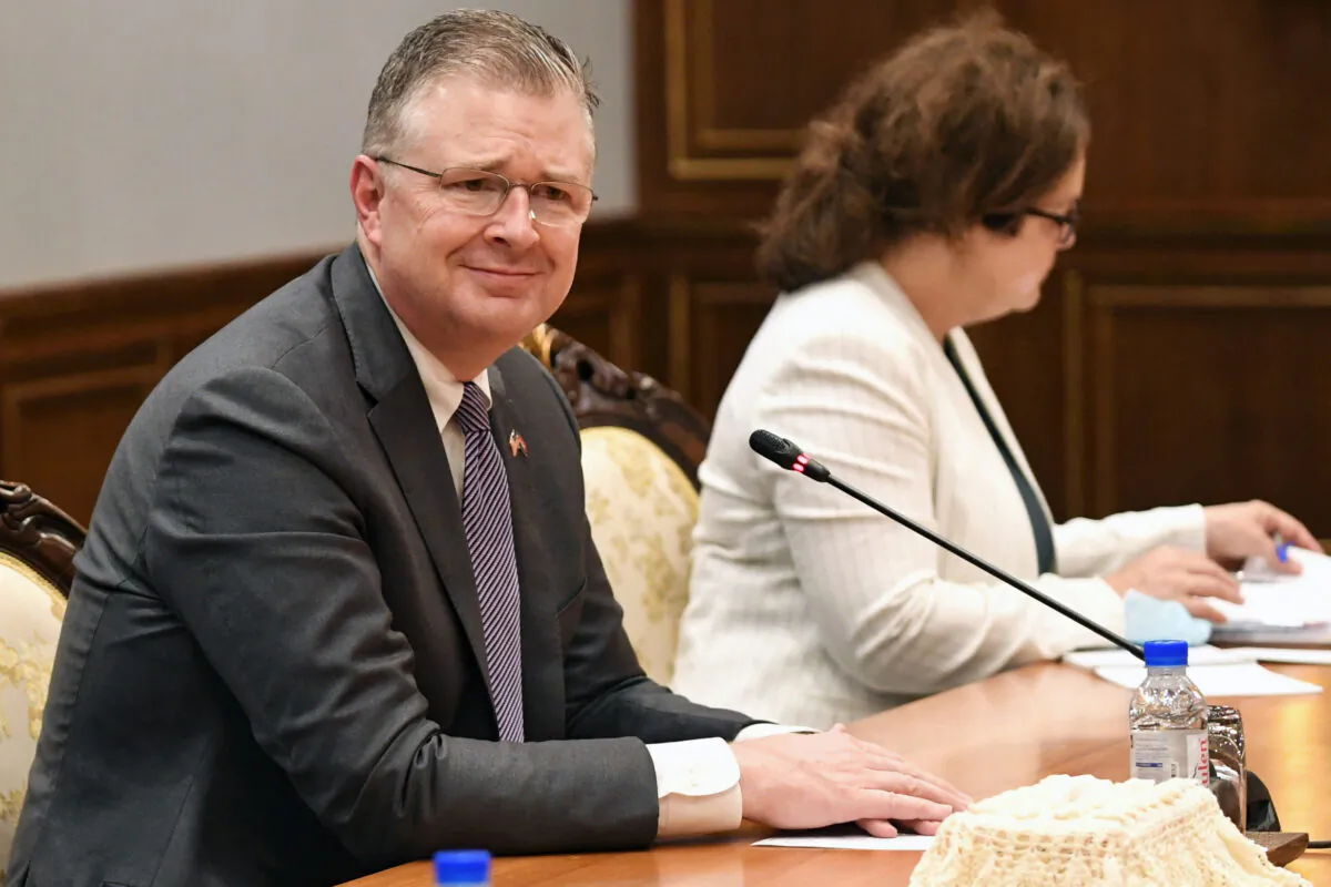 U.S. Assistant Secretary of State for East Asian and Pacific Affairs Daniel J. Kritenbrink (left) listens during a meeting with Cambodian Foreign Minister Prak Sokhonn at the Ministry of Foreign Affairs in Phnom Penh on July 12, 2022. (Tang Chhin Sothy/AFP via Getty Images)