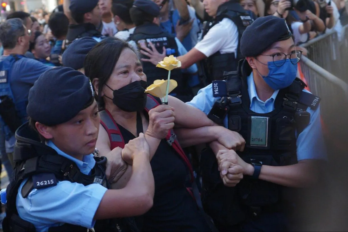 Chan Po-ying, chairman of the League of Social Democrats, was taken away by the police, in Hong Kong, on June 4, 2023. (Benson Lau/The Epoch Times)