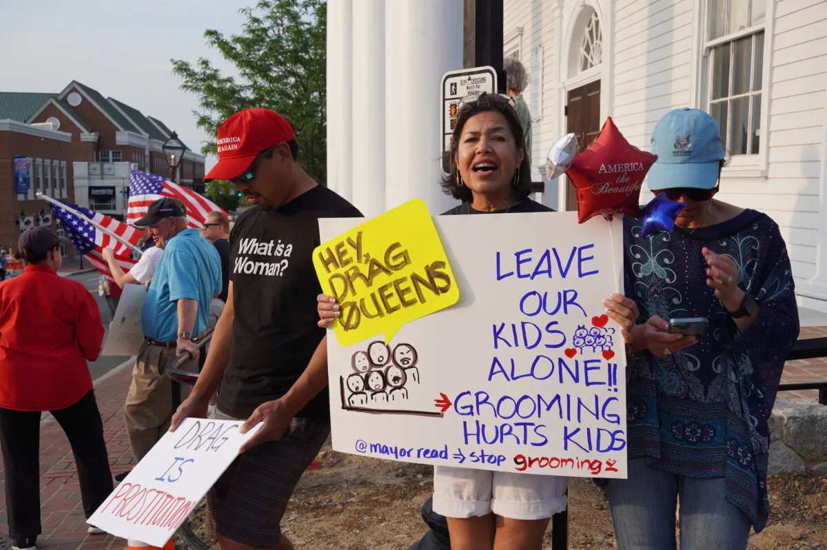 Residents protest a pride month event featuring drag queen performances outside the old town hall in Fairfax, Va., on Jun. 3, 2023. (Terri Wu/The Epoch Times)