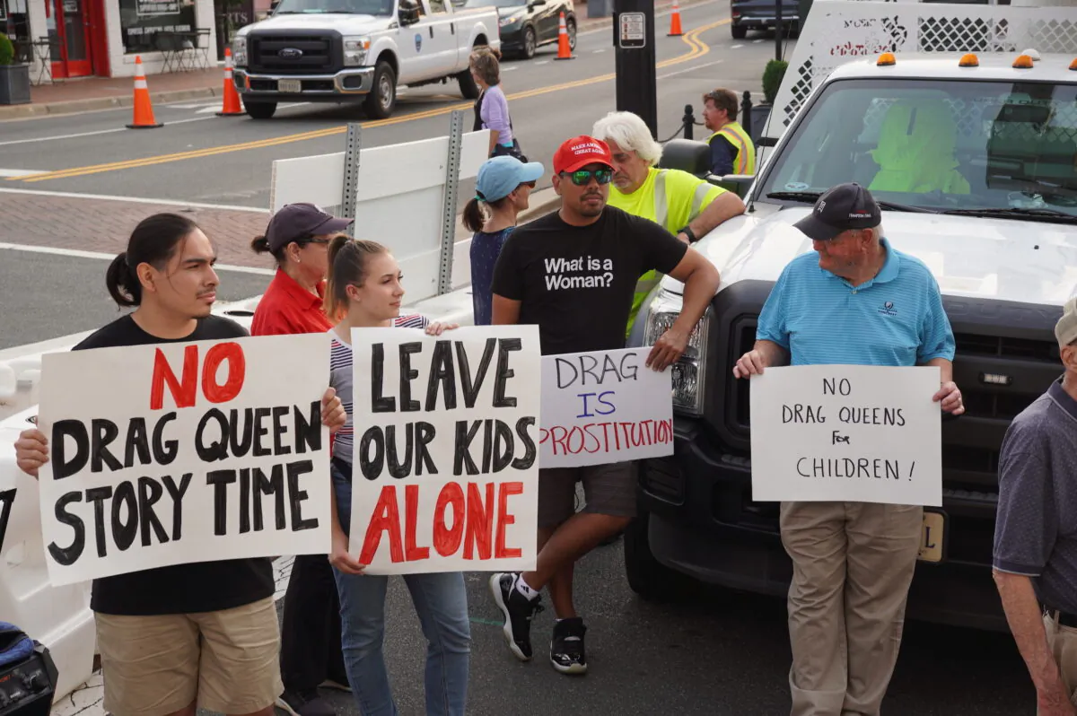 Residents protest a pride month event featuring drag queen performances outside the old town hall in Fairfax, Va., on Jun. 3, 2023. (Terri Wu/The Epoch Times)