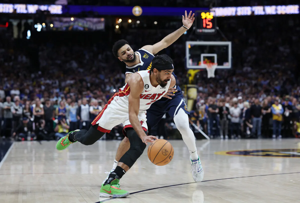 Gabe Vincent (2) of the Miami Heat dribbles against Jamal Murray (27) of the Denver Nuggets during the first quarter in Game Two of the 2023 NBA Finals at Ball Arena in Denver on June 4, 2023. (Matthew Stockman/Getty Images)