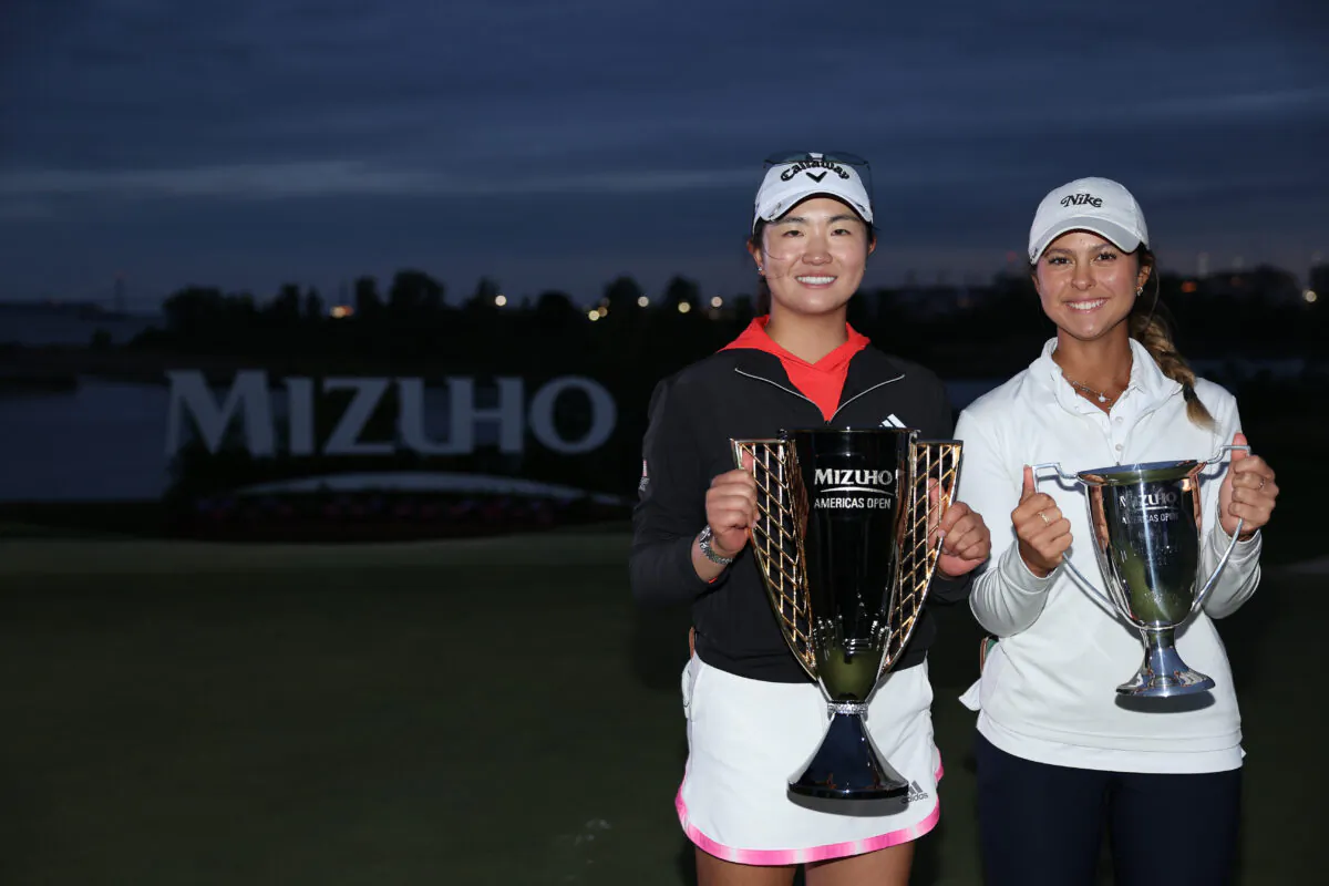 Rose Zhang (L) of Irvine, Calif., and fellow American, low amateur Yana Wilson (R) pose with their trophies after the final round of the Mizuho Americas Open at Liberty National Golf Club in Jersey City, N.J., on June 4, 2023. (Elsa/Getty Images)