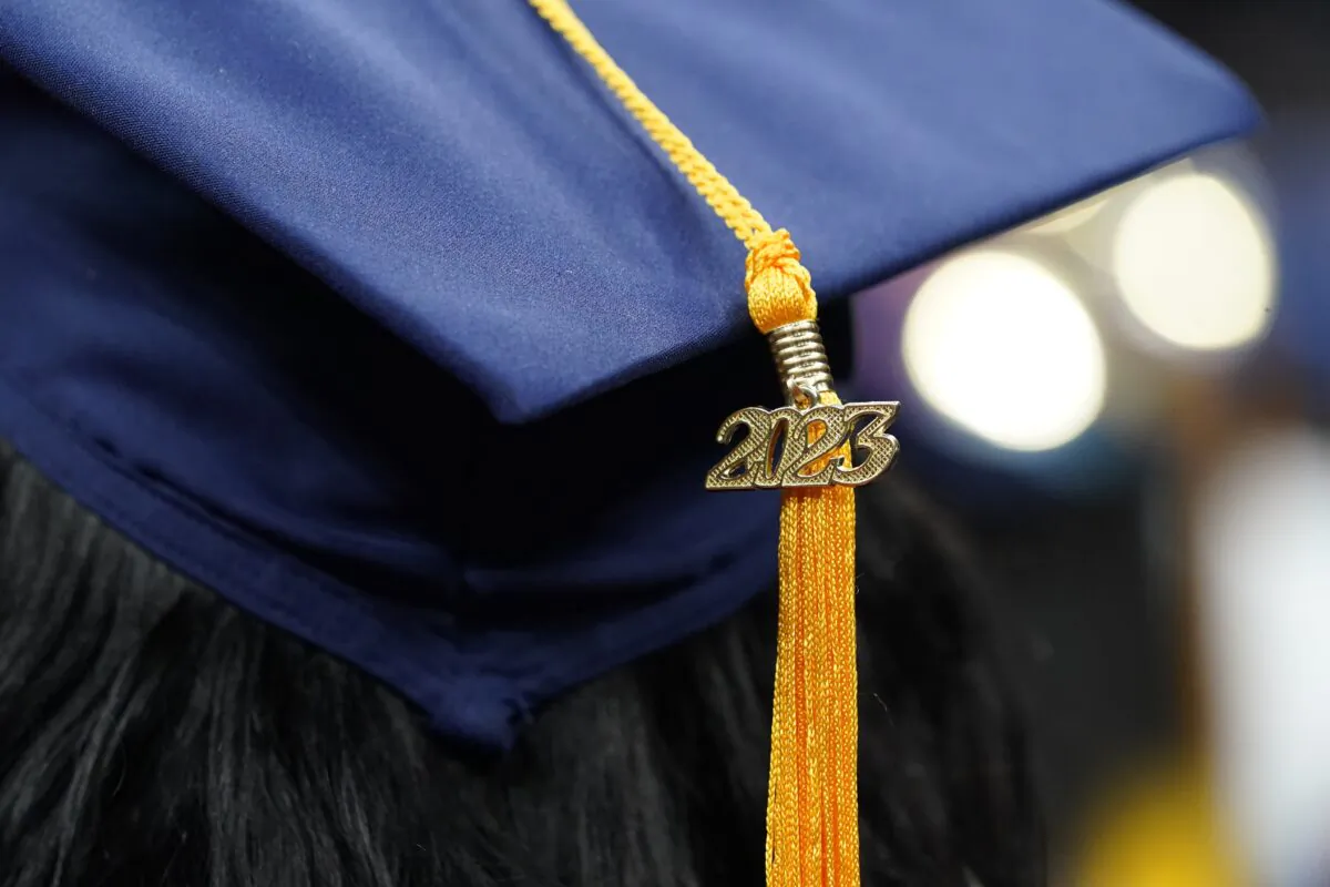 A tassel with 2023 on it rests on a graduation cap as students walk in a procession for Howard University's commencement in Washington, on May 13, 2023. (Alex Brandon / AP)