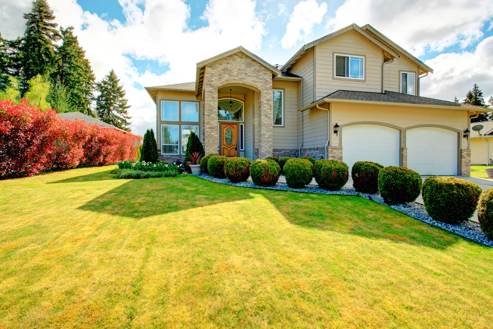 Large lawns are nice for playing yard games and entertaining, but they could also be repurposed as a garden space. (Artazum/Shutterstock)