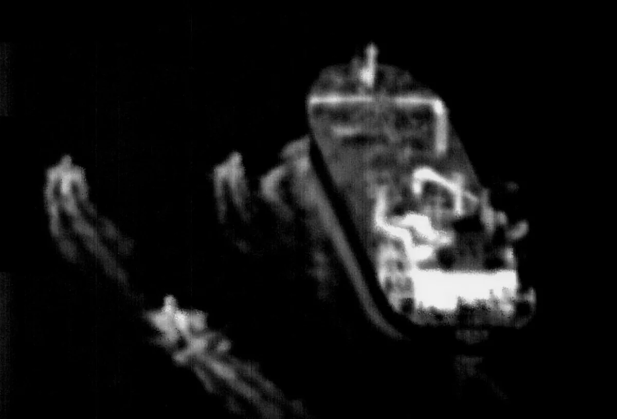 A surveillance image from a U.S. Navy P-8A Poseidon maritime patrol aircraft showing three Iranian fast-attack craft approaching an internationally flagged merchant vessel transiting the Strait of Hormuz on June 4, 2023. (U.S. Navy photo)