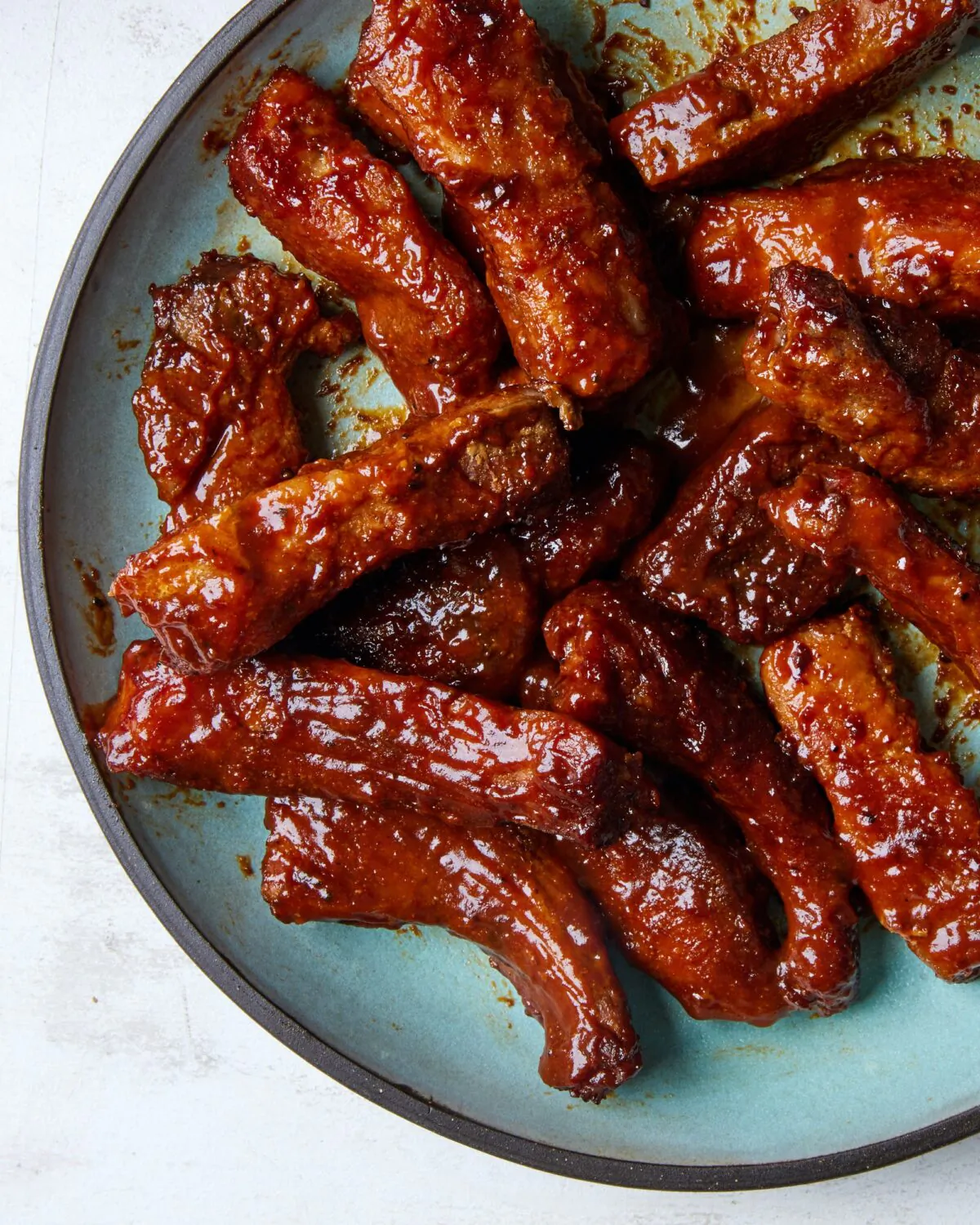 These seasoned country-style “ribs” are glazed with luscious barbecue sauce and get oven-roasted until they’re super tender. (Lucy Schaffer/TNS)