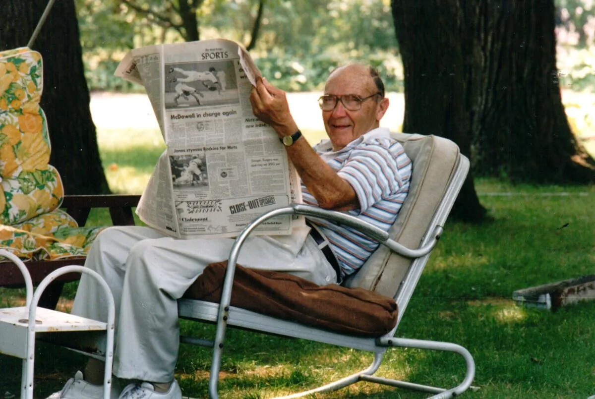 Andrew "Andy" Monteleone reading the sports section of the newspaper. (Courtesy of John J. Monteleone)