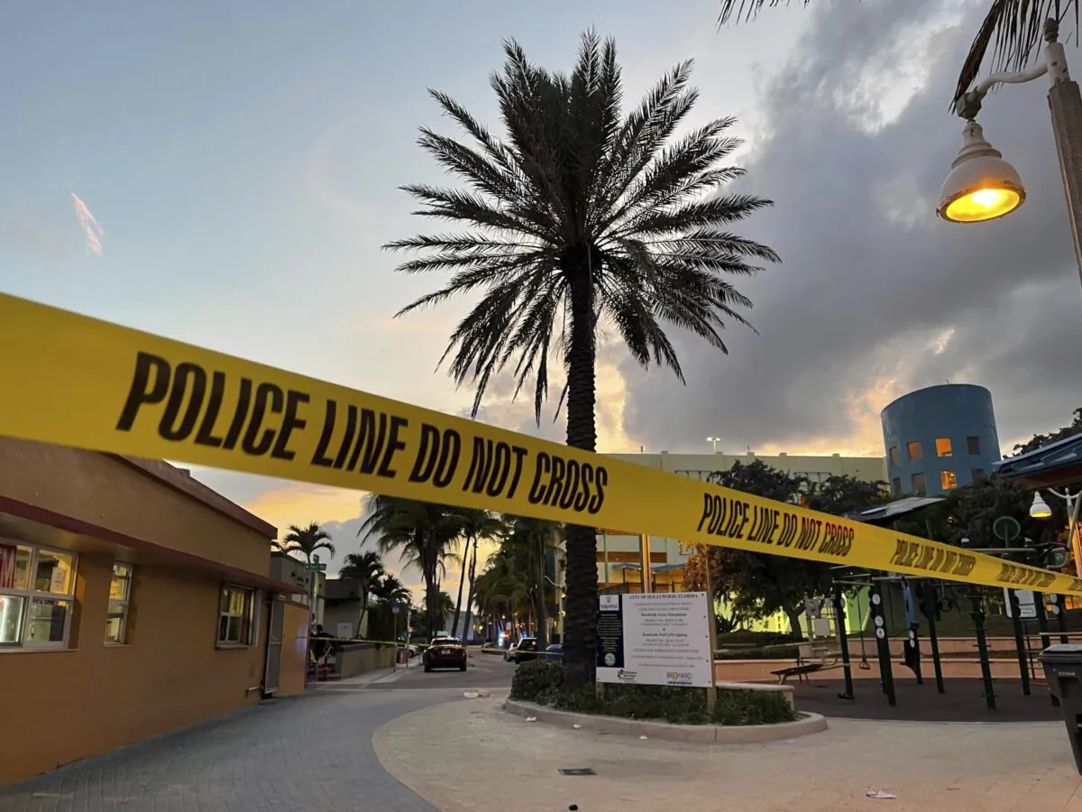 Police cordon off an area as they respond to a shooting near the Hollywood Beach Broadwalk in Hollywood, Fla., on May 29, 2023. (Mike Stocker/South Florida Sun-Sentinel via AP)
