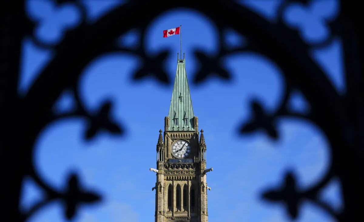 The Canadian flag flies atop the Peace Tower on Parliament Hill in Ottawa on May 5, 2023. (The Canadian Press/Sean Kilpatrick)