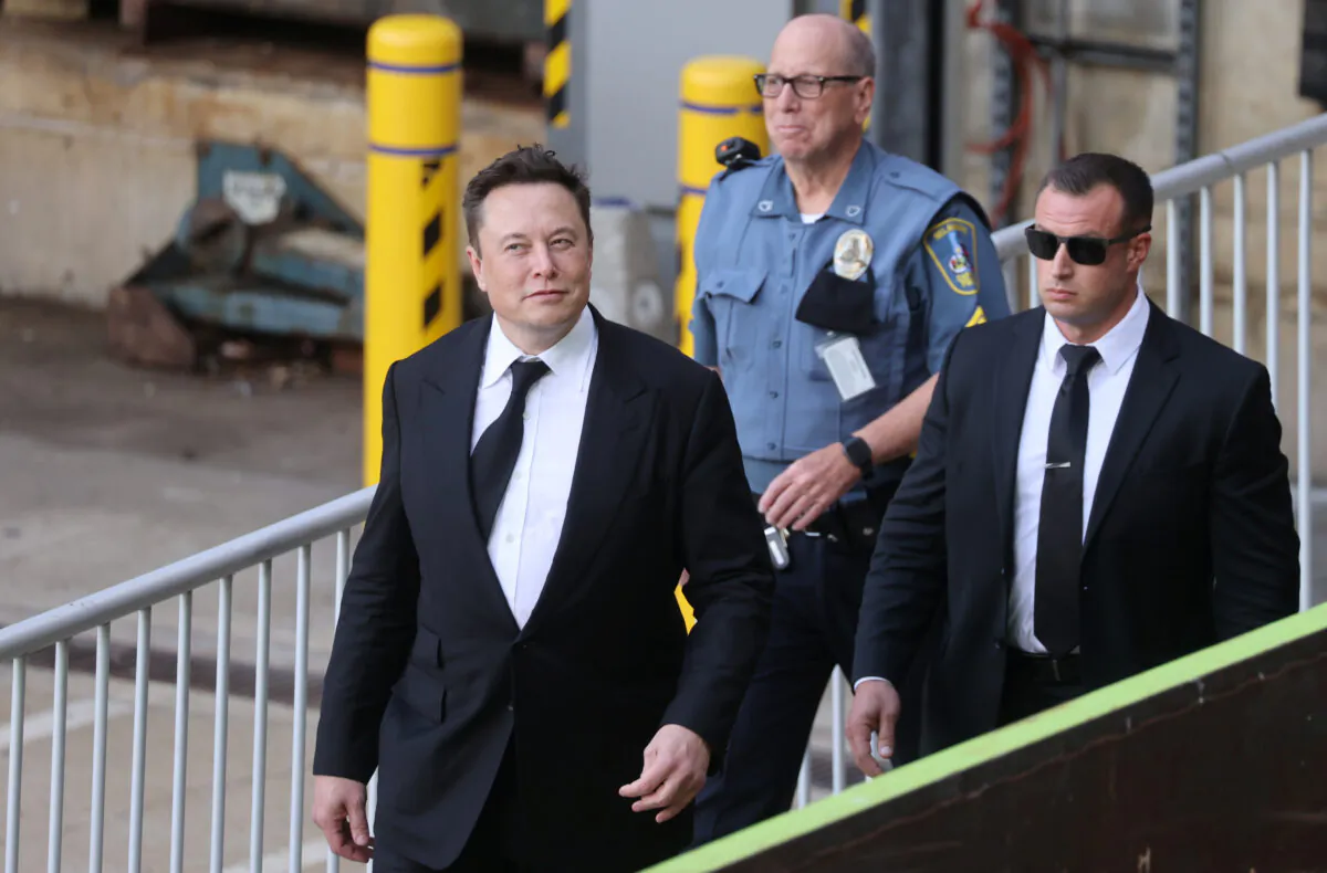 Tesla CEO Elon Musk departs after taking the stand to defend Tesla Inc's 2016 deal for SolarCity in a case before the Delaware Court of Chancery in Wilmington, Del., on July 12, 2021. REUTERS/Jonathan Ernst