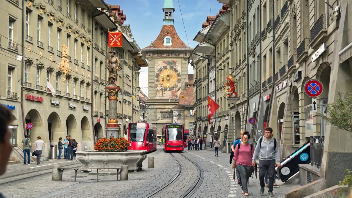 Bern's famous clock tower, part of the original wall around the city, looms at the head of Marktgasse street. (Dominic Arizona Bonuccelli, Rick Steves' Europe)