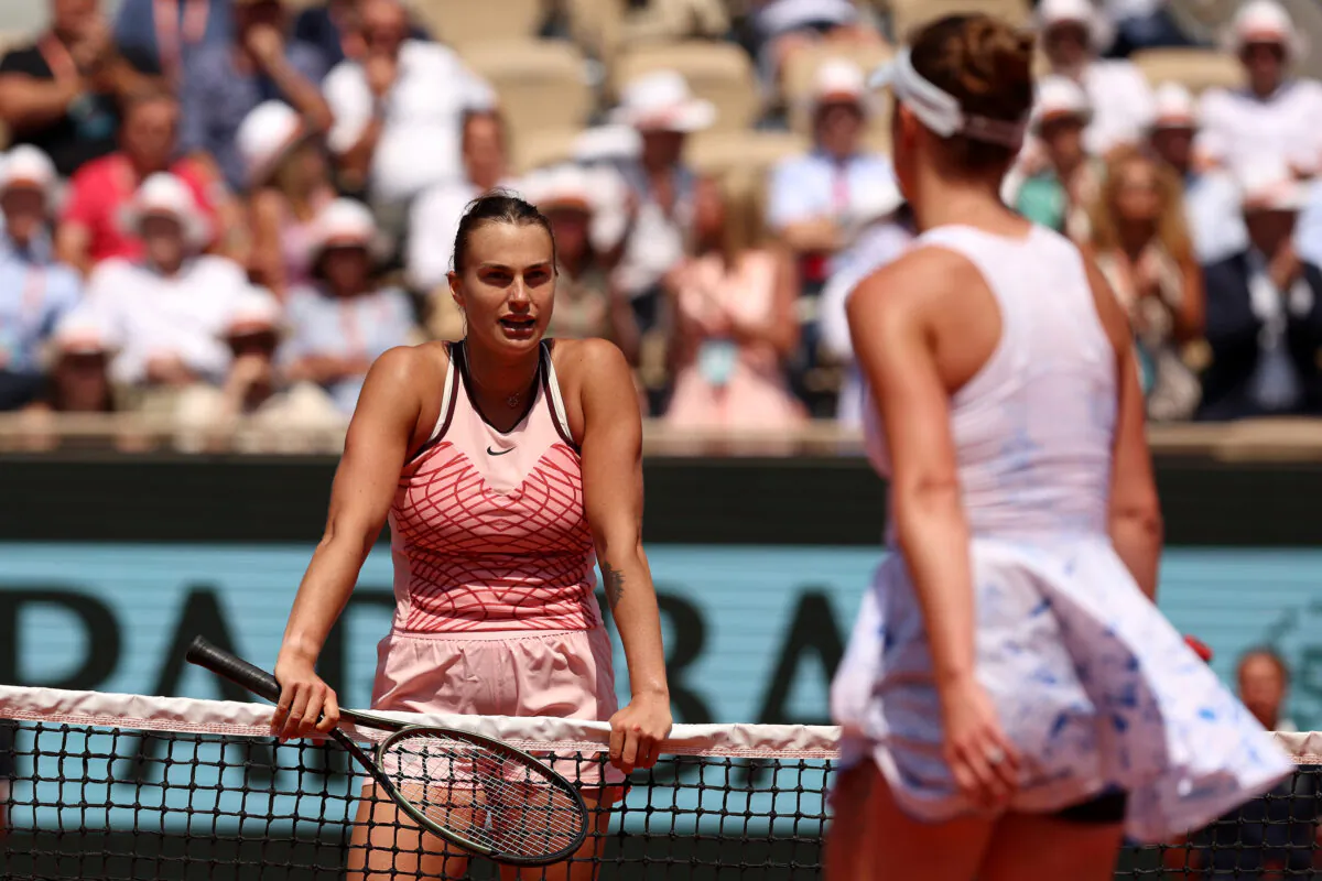 Aryna Sabalenka waits at the net as Elina Svitolina of Ukraine refuses to shake hands after the Women's Singles Quarter Final match on Day Ten of the 2023 French Open at Roland Garros in Paris on June 06, 2023. (Clive Brunskill/Getty Images)