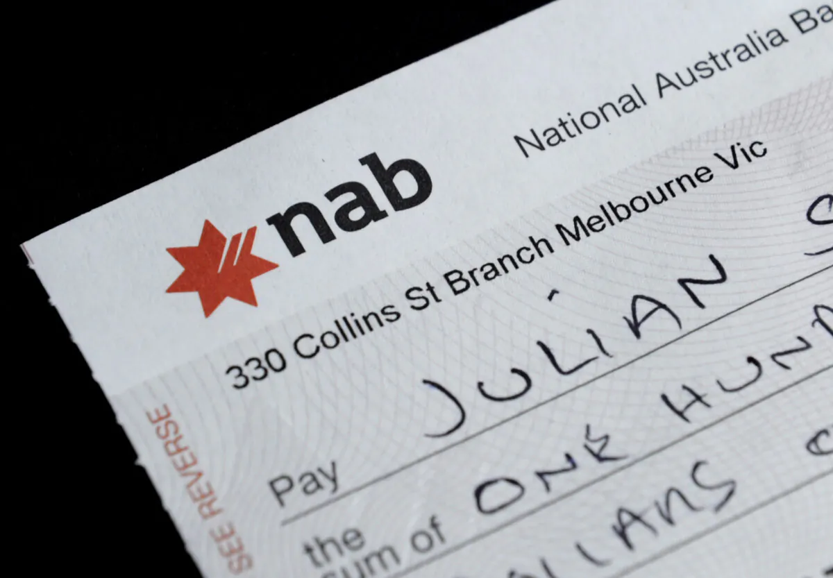 A National Australia Bank cheque is seen in Melbourne, Australia, on Sept. 7, 2012. (AAP Image/Julian Smith) 