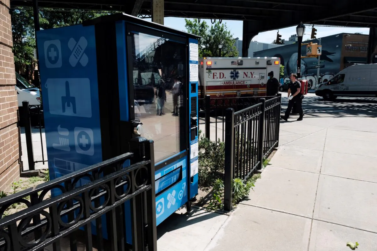 The Adams administration health officials unveil a new vending machine that will disperse fentanyl test strips and naloxone as well as hygiene kits, maxi pads, vitamin C, and COVID-19 tests for free in New York City, in Brooklyn, N.Y., on June 5, 2023. (Spencer Platt/Getty Images)
