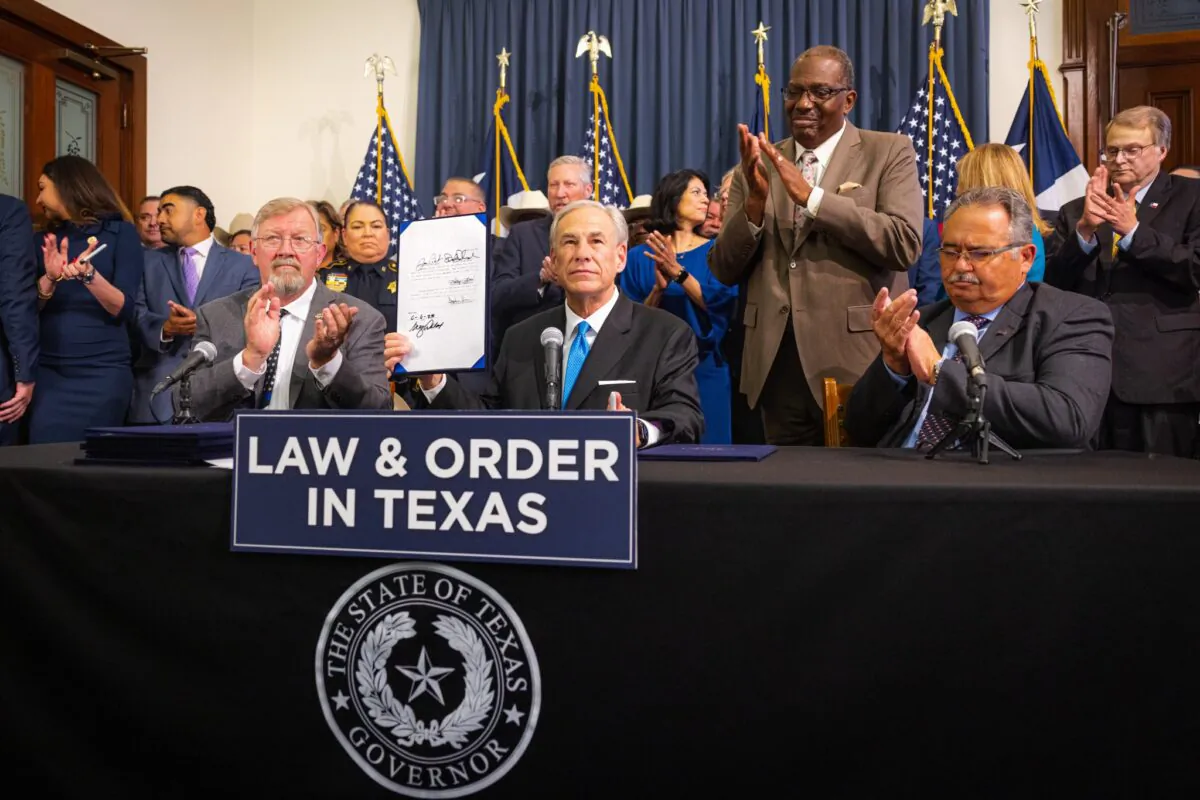 Texas Gov. Greg Abbott signs into law eight public safety bill at the Capitol in Austin, Texas, on June 6, 2023. (Office of the Texas Governor)