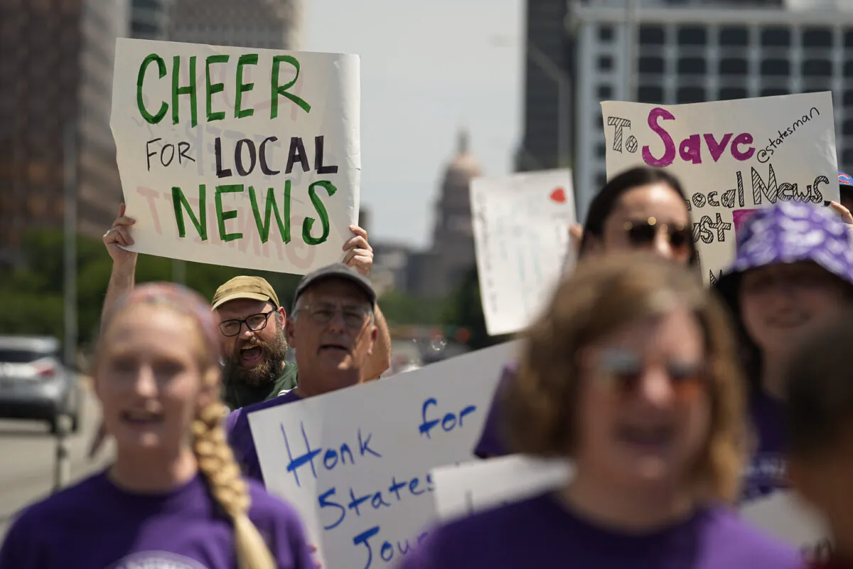 Editorial members of the Austin American-Statesman's NewsGuild picket along the Congress Avenue bridge in Austin, Texas, on June 5, 2023. (Eric Gay/AP Photo)