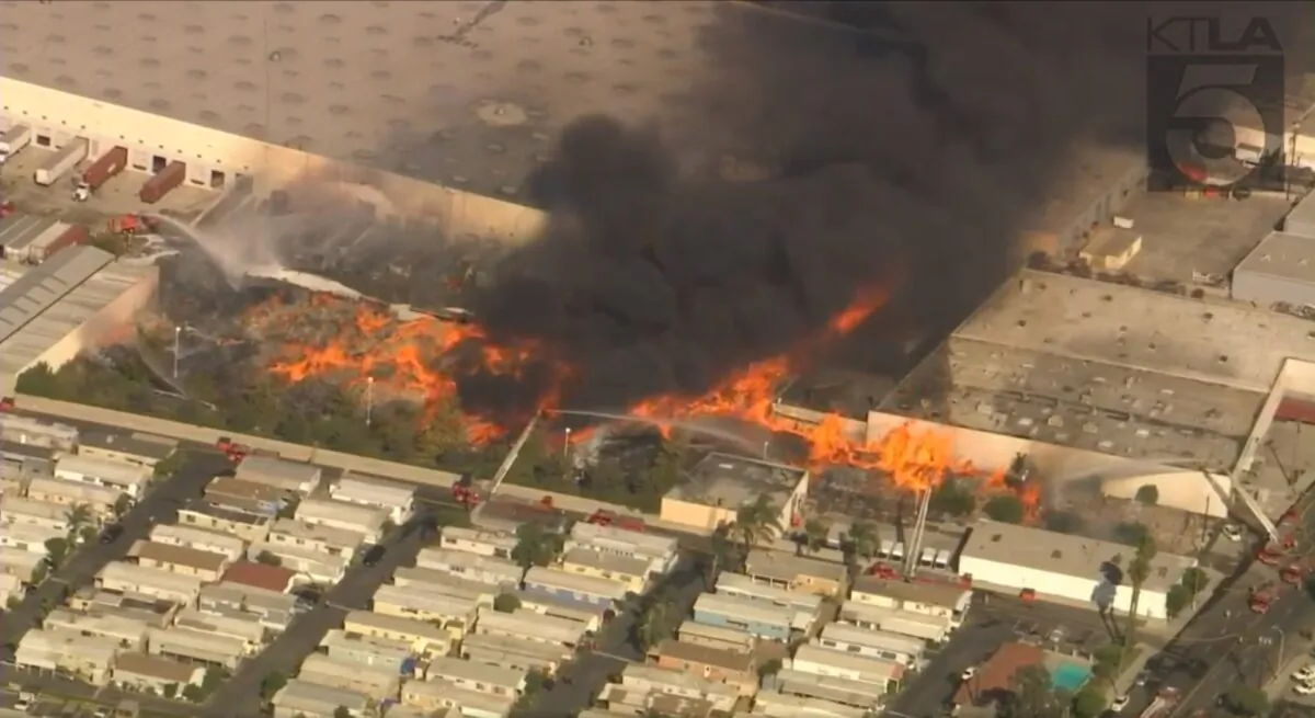 Firefighters battle a massive blaze that broke out at a warehouse in Carson, California, on Sept. 30, 2021. (KTLA5/Facebook, Screenshot)