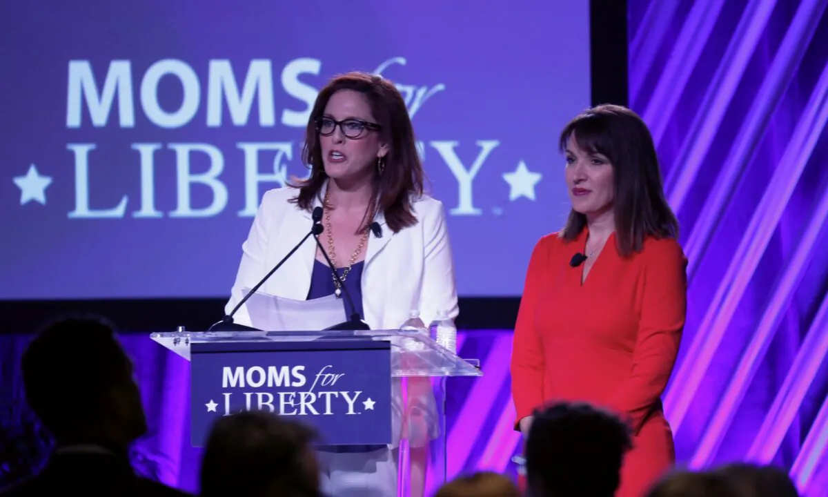 Moms for Liberty founders Tiffany Justice (L) and Tina Descovich give the opening remarks before Florida Gov. Ron DeSantis speaks during the inaugural Moms for Liberty Summit at the Tampa Marriott Water Street in Tampa, Fla., on July 15, 2022. (Octavio Jones/Getty Images)