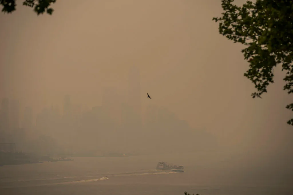 A boat navigates the Hudson River as the New York City skyline is covered with haze and smoke from Canada wildfires in Weehawken, N.J. on June 7, 2023.(Eduardo Munoz Alvarez/Getty Images)