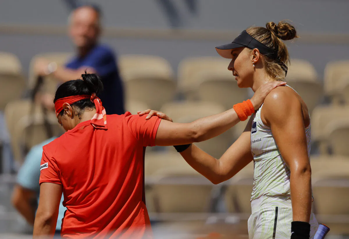 Brazil's Beatriz Haddad Maia (R) shakes hands with Tunisia's Ons Jabeur after winning her quarter final match in Paris, France on June 7, 2023. (Clodagh Kilcoyne/Reuters)