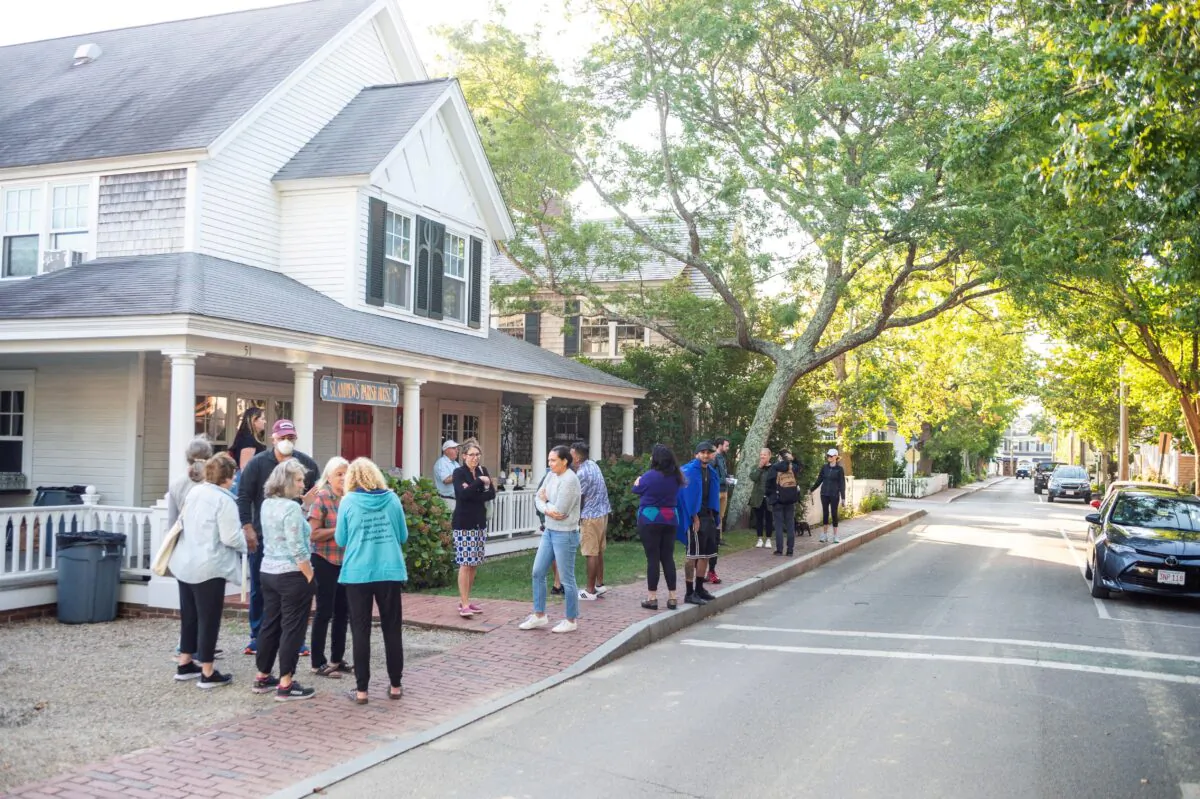 Illegal immigrants gather—after being flown in from Texas on a flight funded by Florida Gov. Ron DeSantis—at Edgartown on Martha's Vineyard, Mass., on Sept. 15, 2022. (Vineyard Gazette/Handout via Reuters)