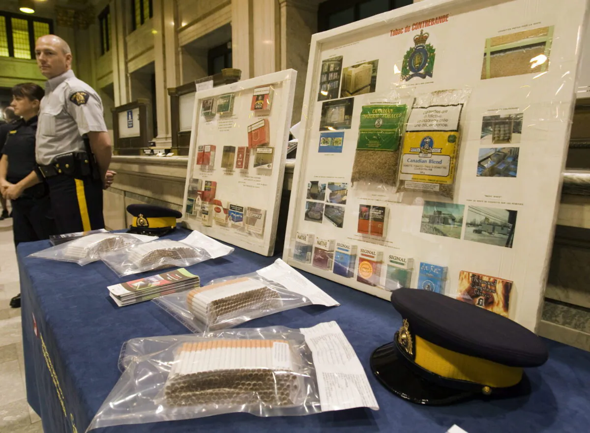 Contraband tobacco is displayed at a news conference where the Canada Border Services Agency announced it would begin using sniffer dogs to combat the illegal tobacco trade in Montreal on May 28, 2010. (Ryan Remiorz/The Canadian Press)