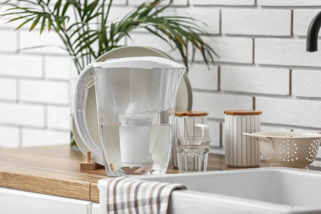 One of the principal ways to reduce fluoride exposure in fluoridated areas is by removing fluoride from both drinking and cooking water. (Pixel-Shot/Shutterstock)