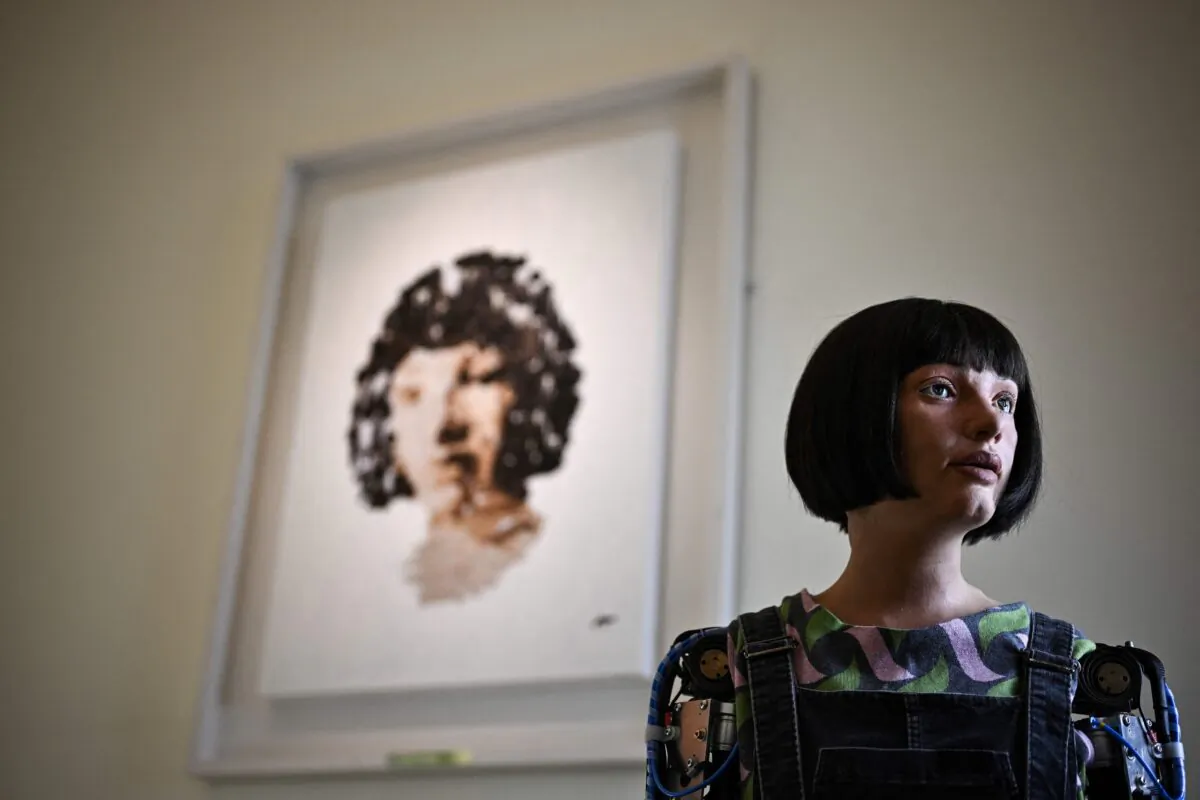 Ultra-realistic AI robot Ai-Da poses in front of a painting she made during the press preview of the London Design Biennale 2023 at Somerset House, central London, on June 1, 2023. June 1 to June 25 the Somerset House hosts London Design Biennale. (Photo by Ben Stansall / AFP) / RESTRICTED TO EDITORIAL USE - MANDATORY MENTION OF THE ARTIST UPON PUBLICATION - TO ILLUSTRATE THE EVENT AS SPECIFIED IN THE CAPTION (Photo by BEN STANSALL/AFP via Getty Images)