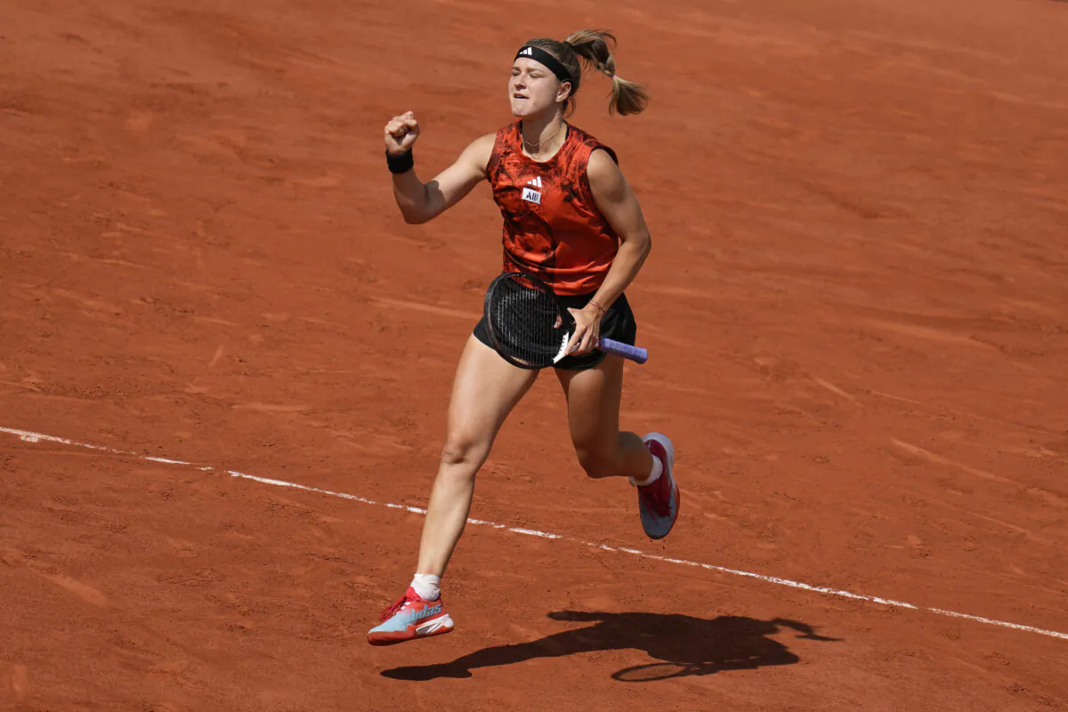 Karolina Muchova clenches her fist after winning the first set against Aryna Sabalenka during their semifinal match of the French Open tennis tournament at the Roland Garros stadium in Paris on June 8, 2023. (Thibault Camus/ AP Photo)