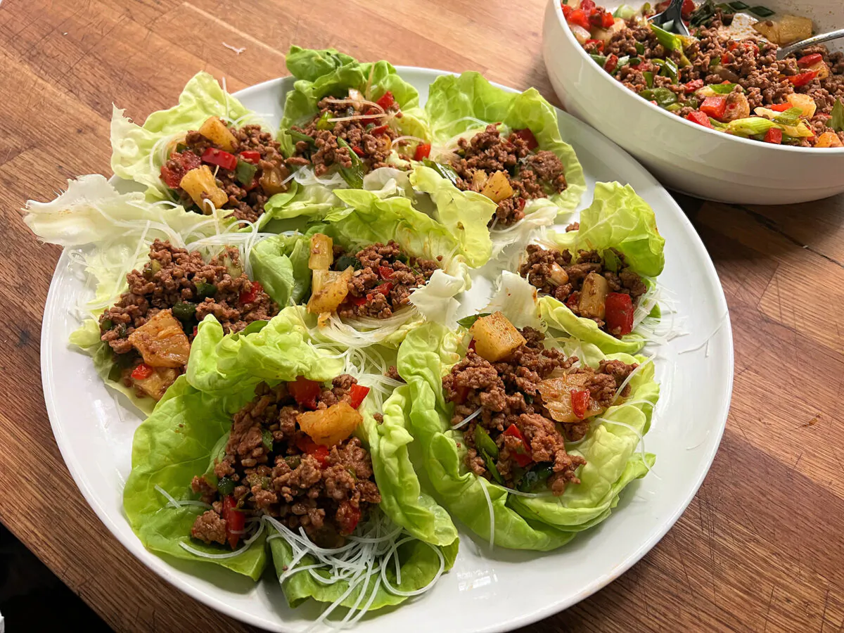 Lettuce wraps filled with ground pork tossed in red curry with pepper and pineapple. (Gretchen McKay/Pittsburgh Post-Gazette/TNS)