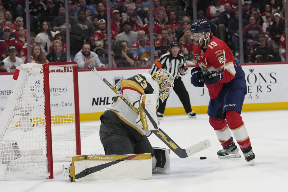 Vegas Golden Knights goaltender Adin Hill (33) goes after a shot on goal by Florida Panthers left wing Matthew Tkachuk (19) during the second period of Game 3 of the NHL hockey Stanley Cup Finals in Sunrise, Fla., on June 8, 2023. (Lynne Sladky/AP Photo)