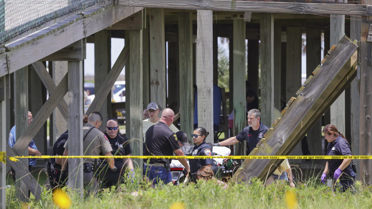 An elevated walkway collapsed and injured several members of a visiting youth group at Stahlman Park in Surfside Beach, Texas, on June 8, 2023. (Mike Felix/The Brazosport Facts via AP)