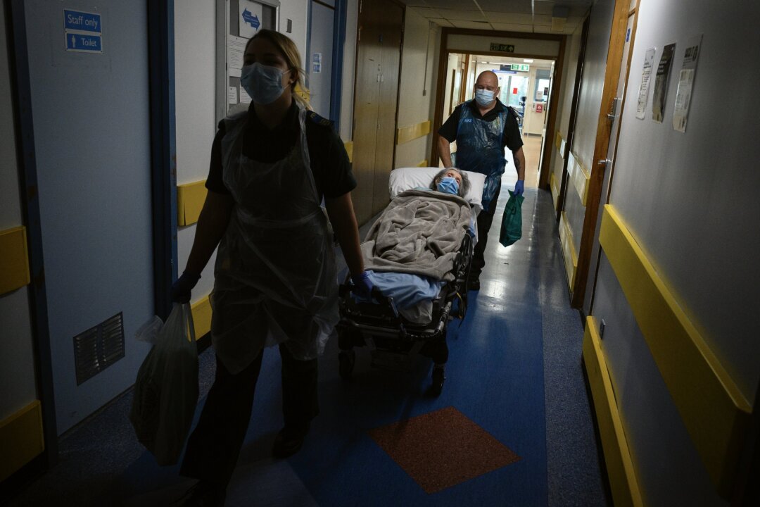 An elderly patient is moved from hospital to a care home near Portsmouth, England, on May 5, 2020. (Leon Neal - Pool/Getty Images)