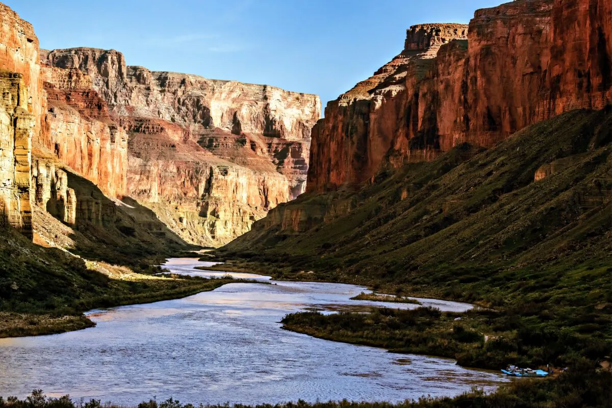 Springtime greenery on slopes of canyon walls as evening settles over the river. (Maria Coulson)