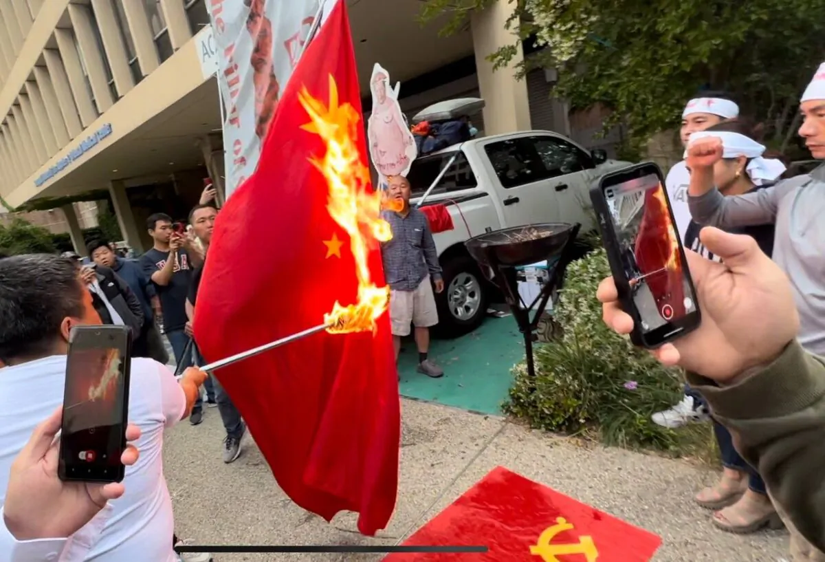 Protesters burn the Chinese Communist Party flag in front of the Chinese Consulate in Los Angeles on the 34th anniversary of the Tiananmen Square Massacre June 4, 2023. (Courtesy of Jie Lijian)