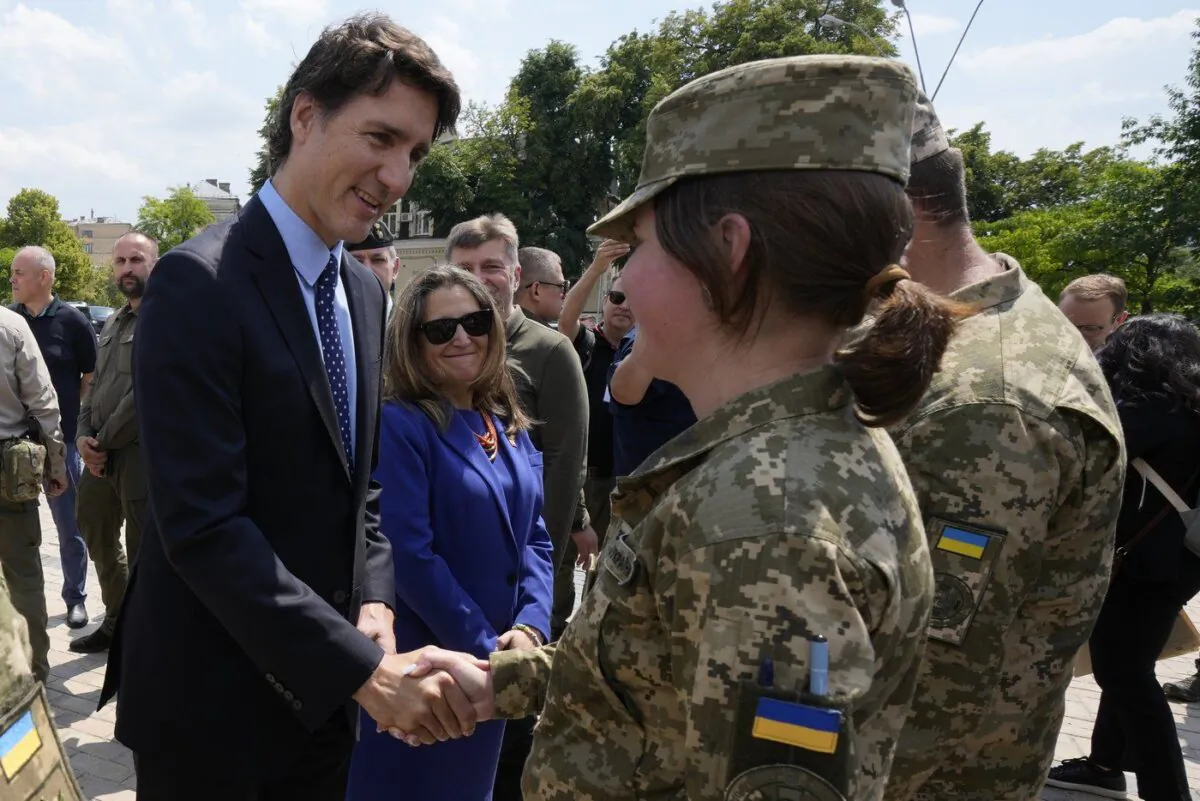 Prime Minister Justin Trudeau, accompanied by Deputy Prime Minister and Minister of Finance Chrystia Freeland, meets with soldiers in Kyiv, Ukraine, on June 10, 2023. (The Canadian Press/Frank Gunn)