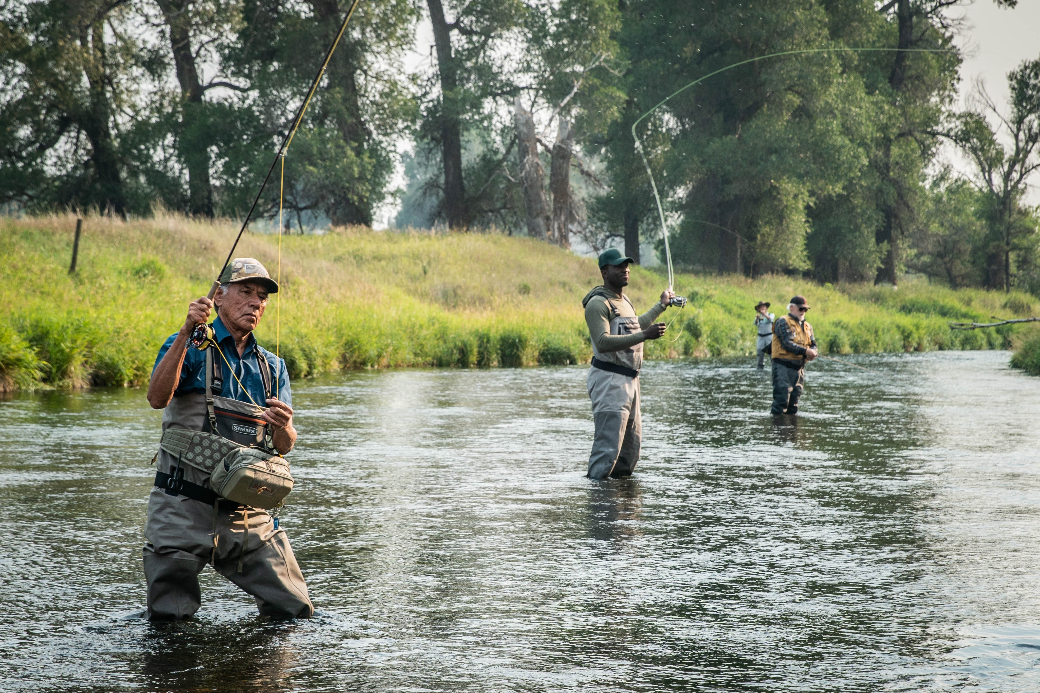 four fly-fishers in MENDING THE LINE