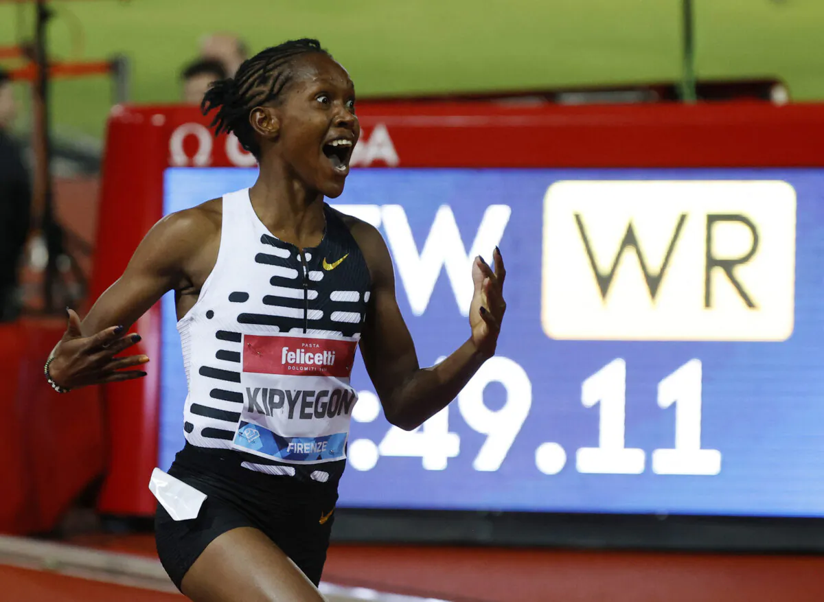 Kenya's Faith Kipyegon celebrates winning the women's 1500m final and setting a new world record in Florence, Italy on June 2, 2023. (Ciro de Luca/Reuters) 