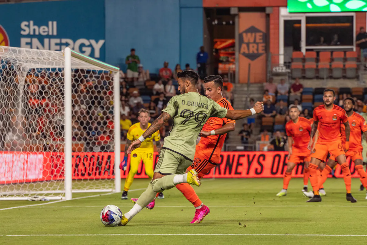 Los Angeles FC forward, Denis Bouanga (99) attacks the defense of the Houston Dynamo at Shell Energy Stadium in Houston, on June 10, 2023. (Courtesy of LAFC via The Epoch Times)