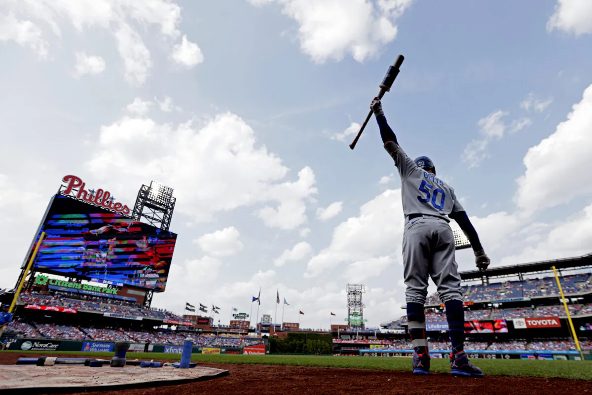 Mookie Betts (50) of the Los Angeles Dodgers warms up in the on deck circle during the first inning of a game against the Philadelphia Phillies at Citizens Bank Park in Philadelphia on June 10, 2023. (Rich Schultz/Getty Images)