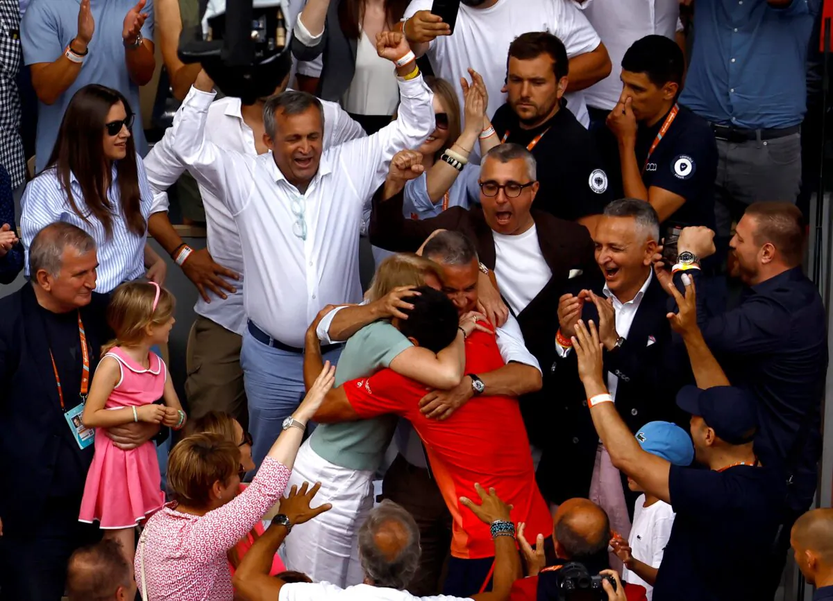 Serbia's Novak Djokovic celebrates with his parents, Dijana Dokovic and Srdjan Djokovic, after winning the French Open in Roland Garros, Paris on June 11, 2023. (Clodagh Kilcoyne/Reuters)