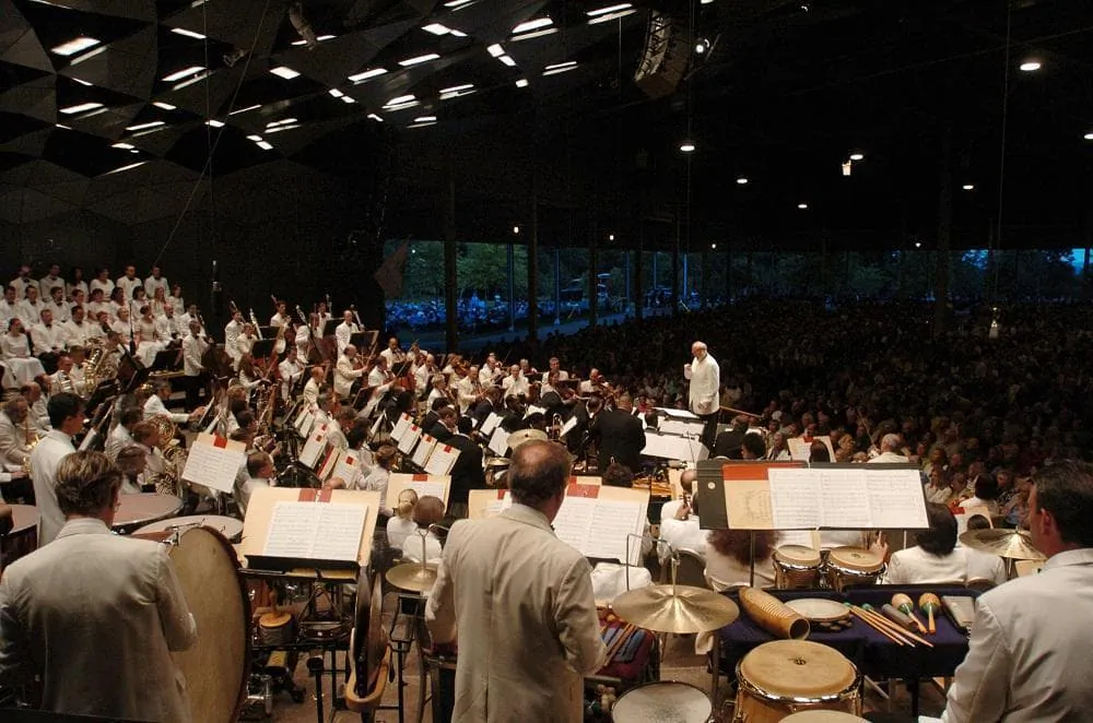 In this file photo, Kurt Masur conducts the Boston Symphony Orchestra on the season's opening night at Tanglewood in Lenox, Mass., on July 9, 2004. (Paul Franz/AP Photo)