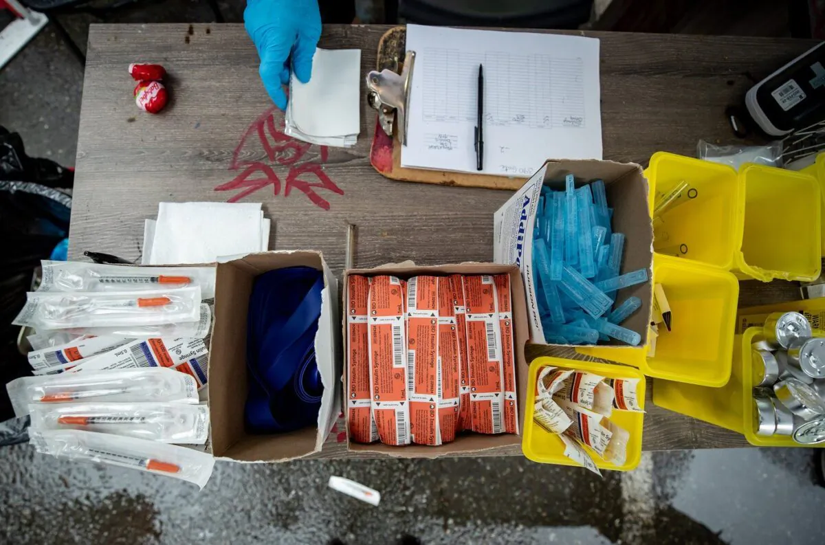 Supplies are seen on a table at an outdoor supervised consumption site in the Downtown Eastside of Vancouver, on May 27, 2021. (The Canadian Press/Darryl Dyck)